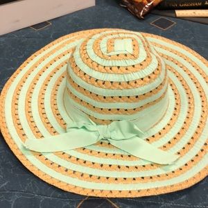Mint and tan wide brim hat.
